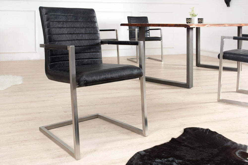 Set 2 scaune cu brate tapitat cu Piele artificiala Negru si picioare din Otel inoxidabil Argintiu H91xL54xA55cm Loft
